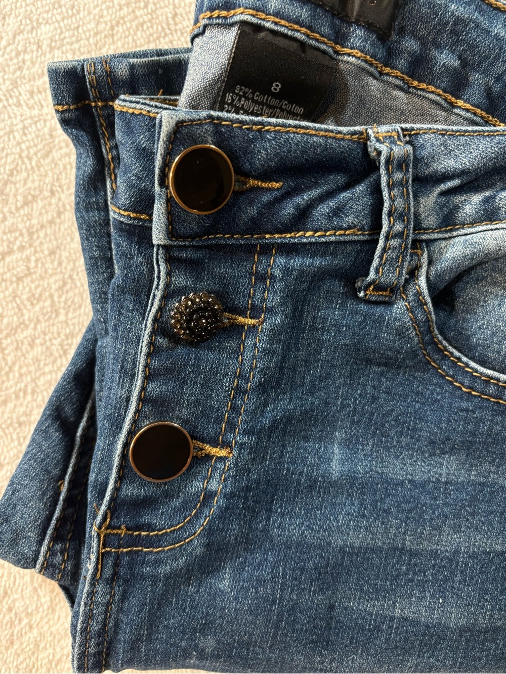 High-Rise Women’s Dark Blue Denim Jeans with Decorative Buttons
